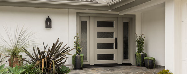 decorative image of luxury home with a custom painted door with glass sidelights